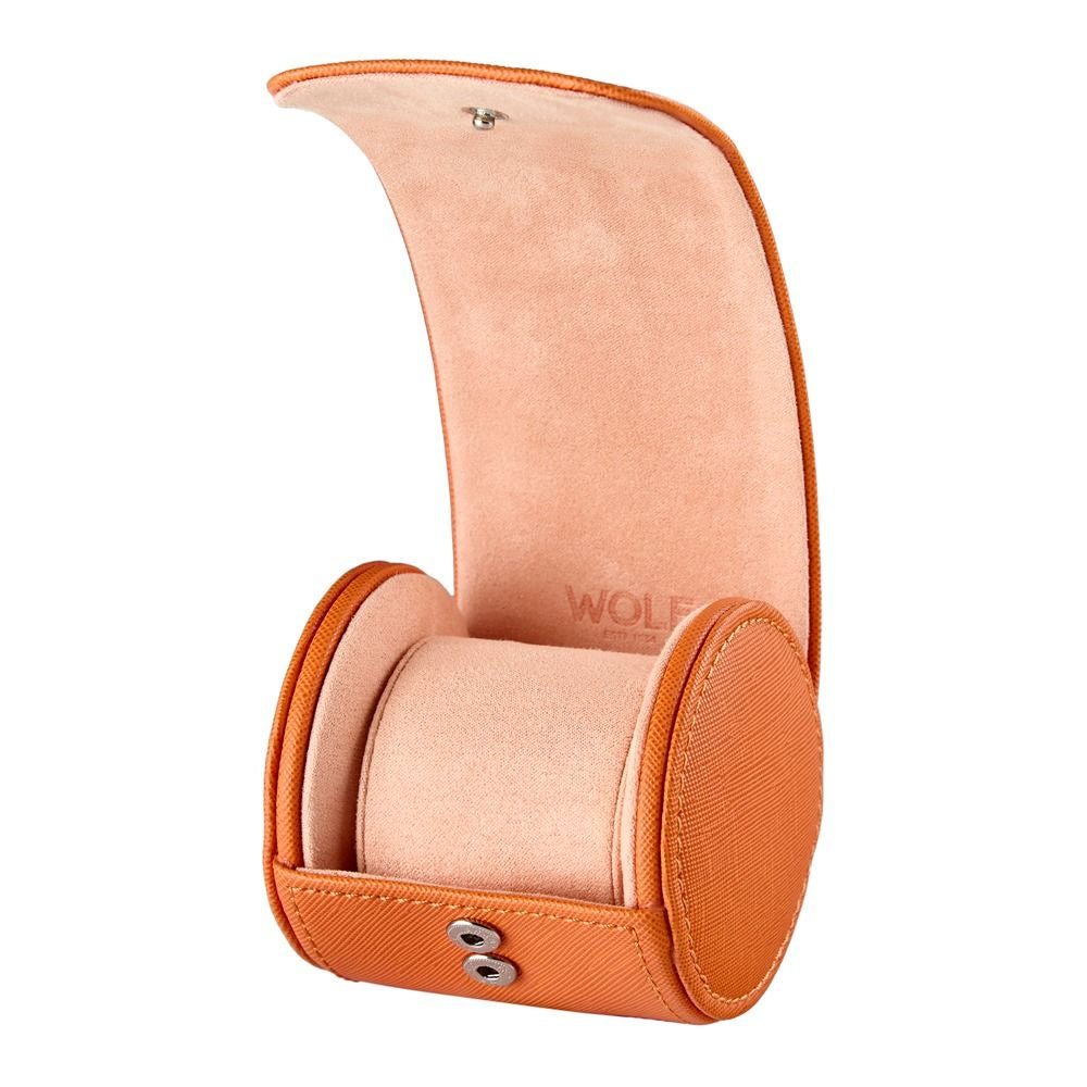 Orange watch case with a pink interior on a white background