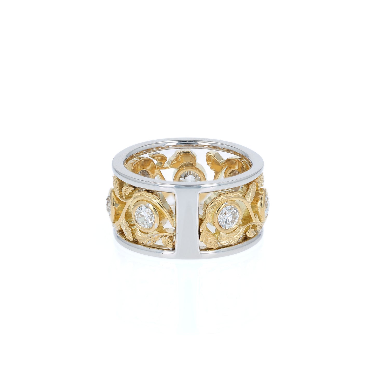 Two-tone gold open work floral band with diamond bezels on a white background