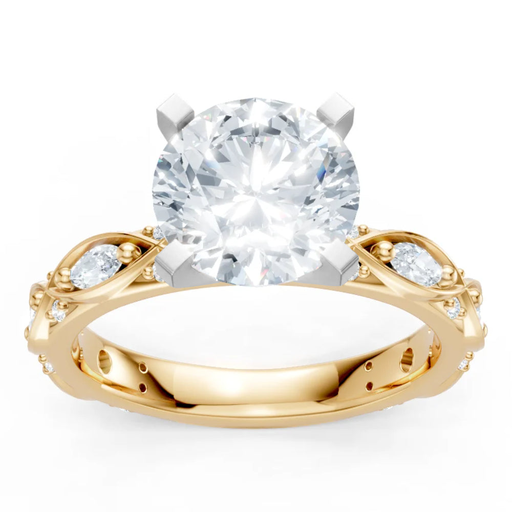 A yellow gold engagement ring with diamonds on the shank and a white gold head for a round center stone on a white background