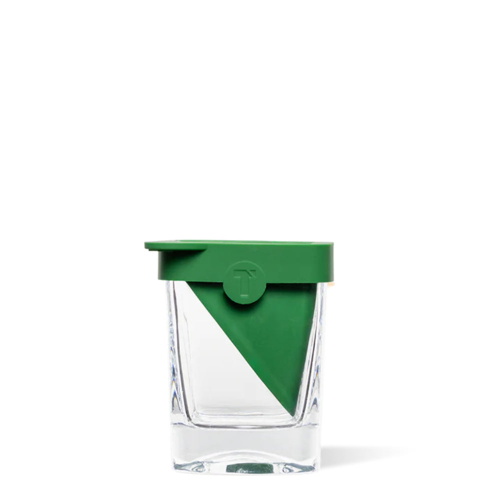 Clear glass tumbler with green tequila triangle  lid on a white background.