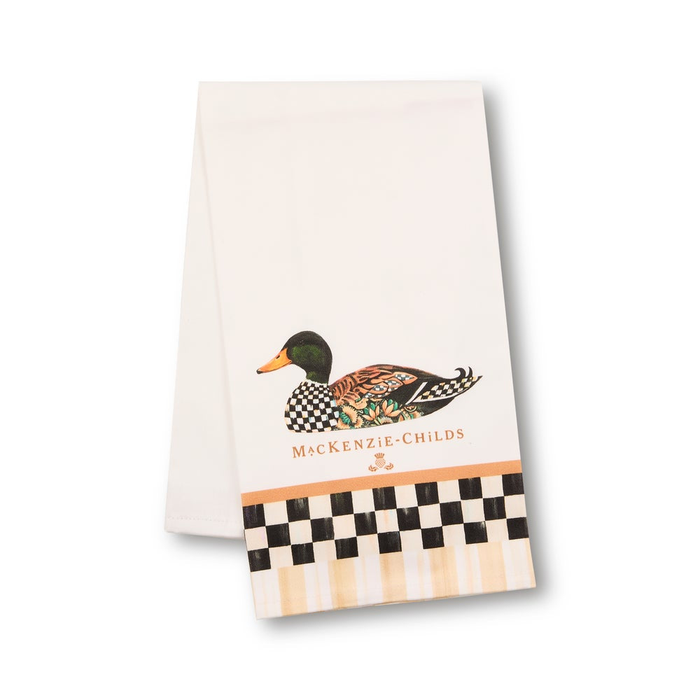 A white kitchen towel featuring a mallard duck illustration, the text 'MCKENZIE-CHILDS', and a checkered border at the bottom, shown on a clean white background.