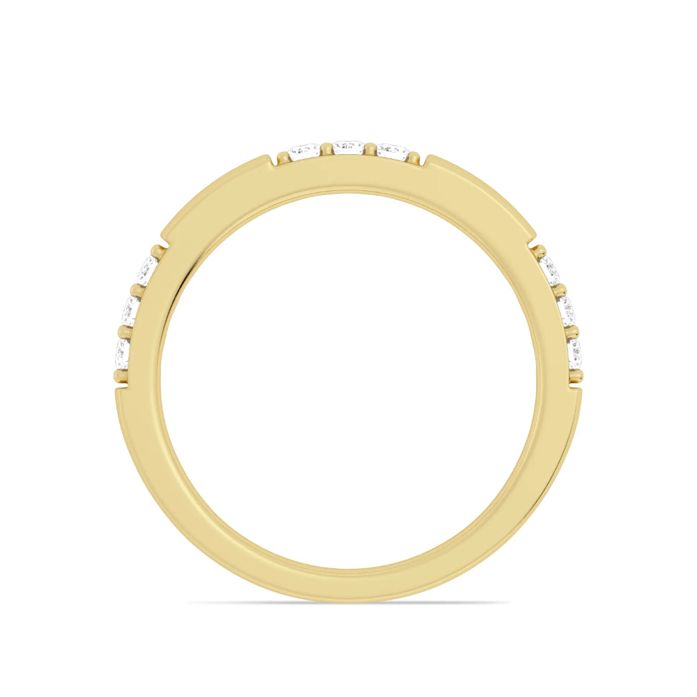 Gold ring with embedded diamonds on a white background