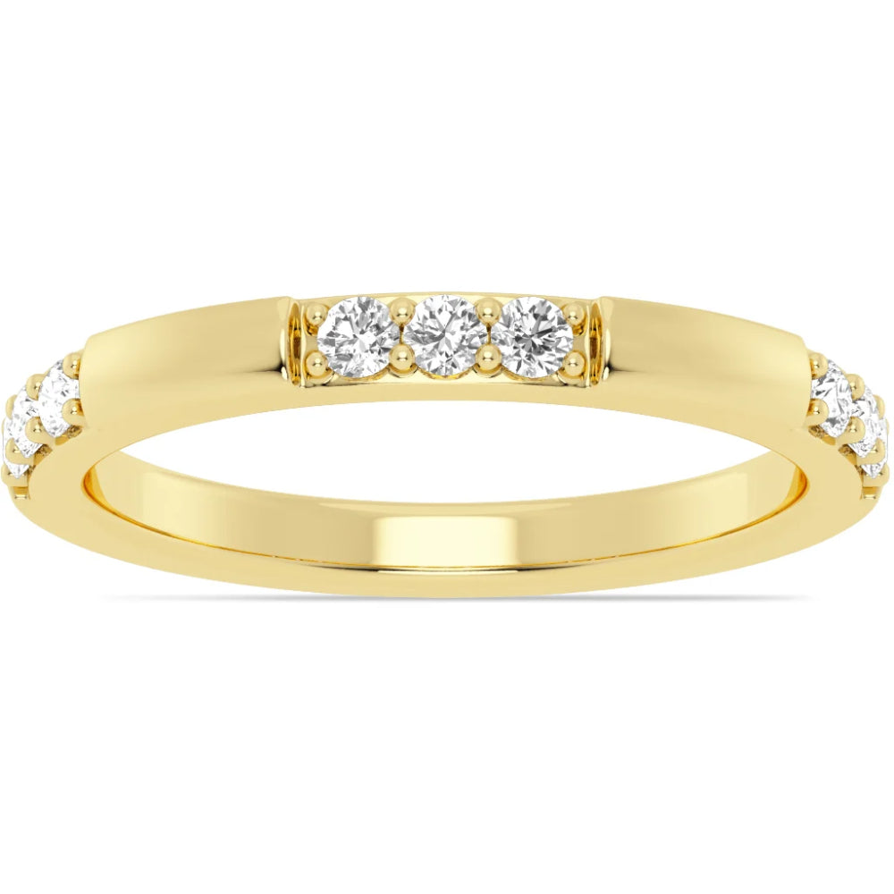 Gold ring with embedded diamonds on a white background