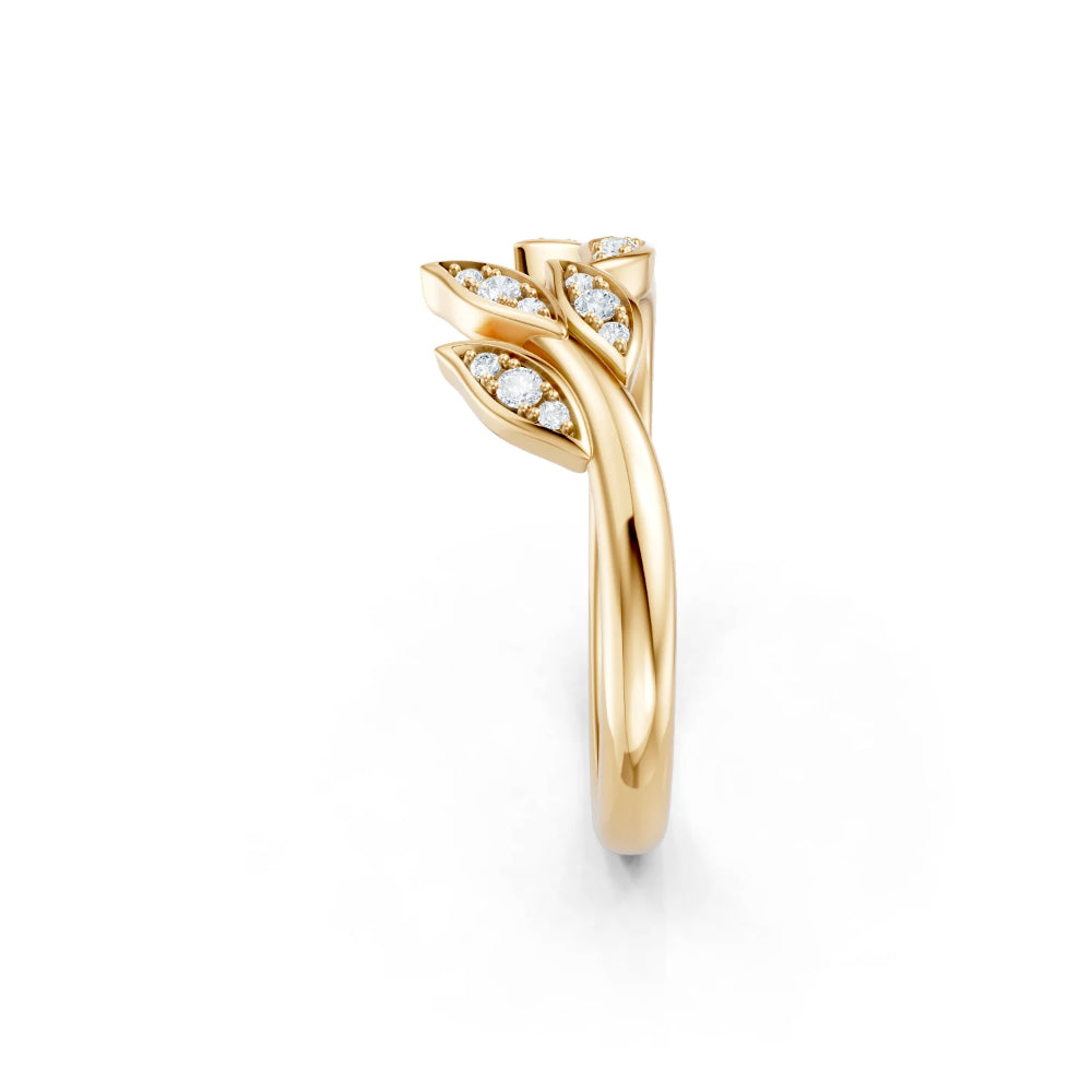 Gold ring with diamond accents on a white background