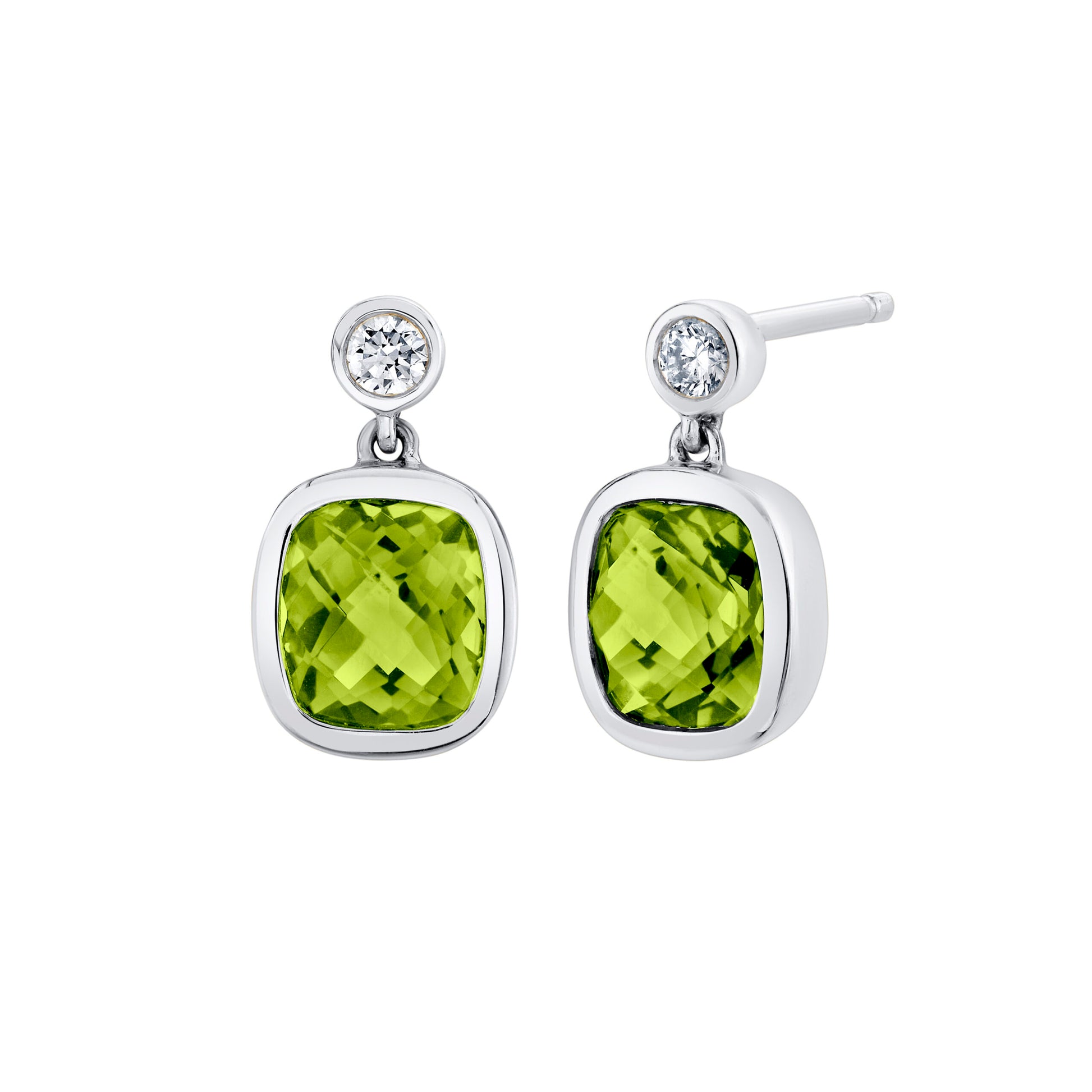 Pair of earrings with green gemstones and clear stones on a white background
