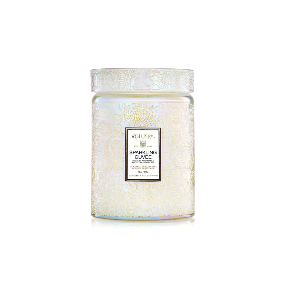 Large white Spakling Cuvee candle on a white backround. 