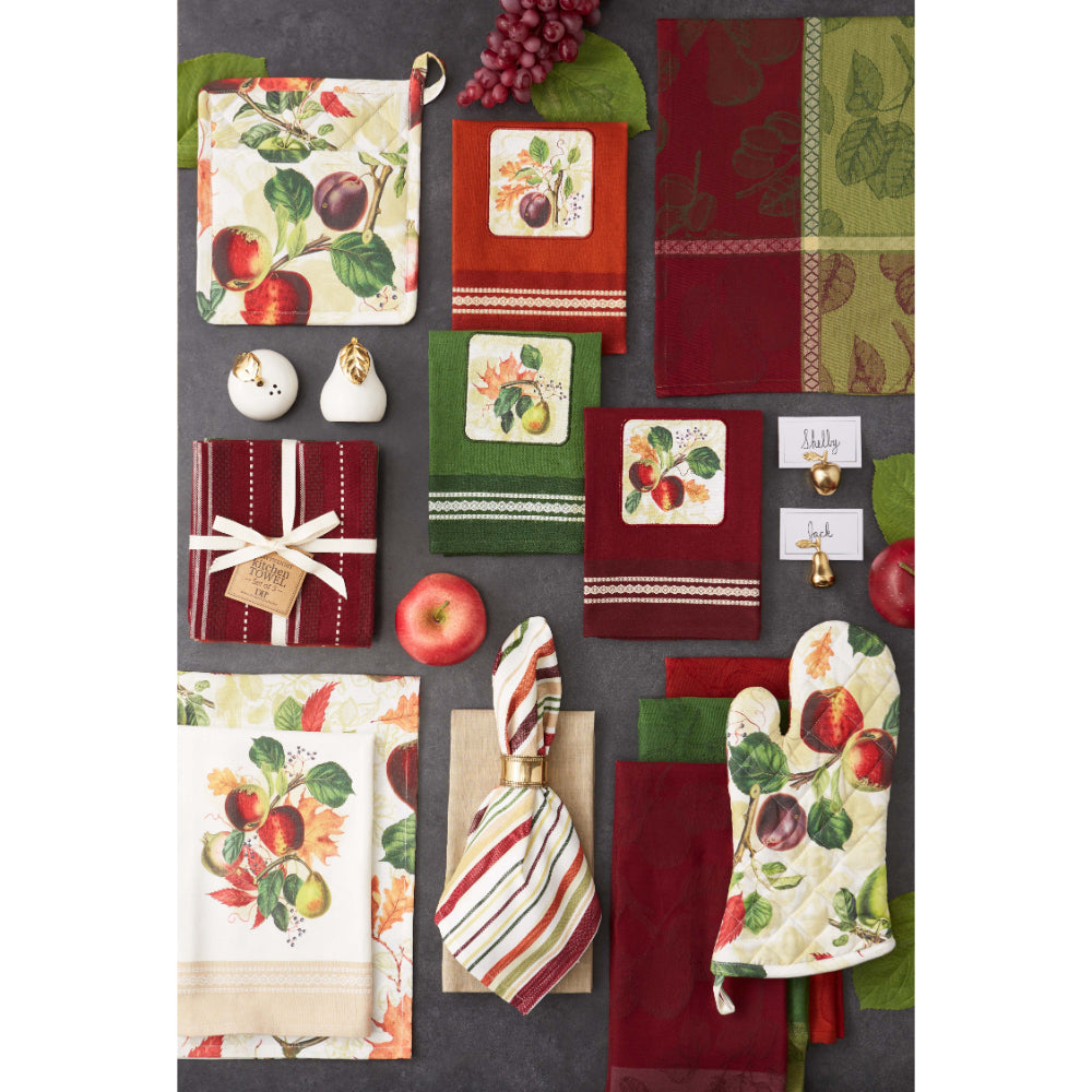 Collection of kitchen towels, oven mitts, and trivets with fruit design on a dark surface.
