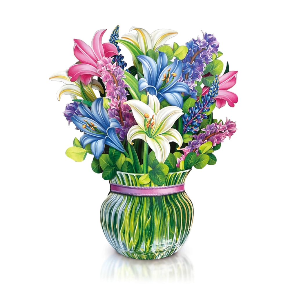 Colorful bouquet of flowers in a decorative vase on a white background