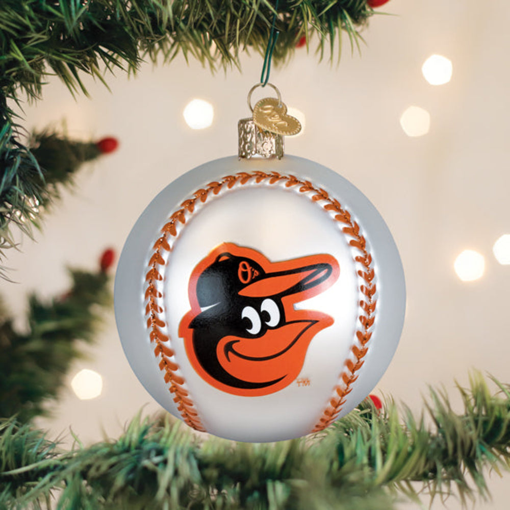 Baseball-shaped ornament with a logo on a Christmas tree