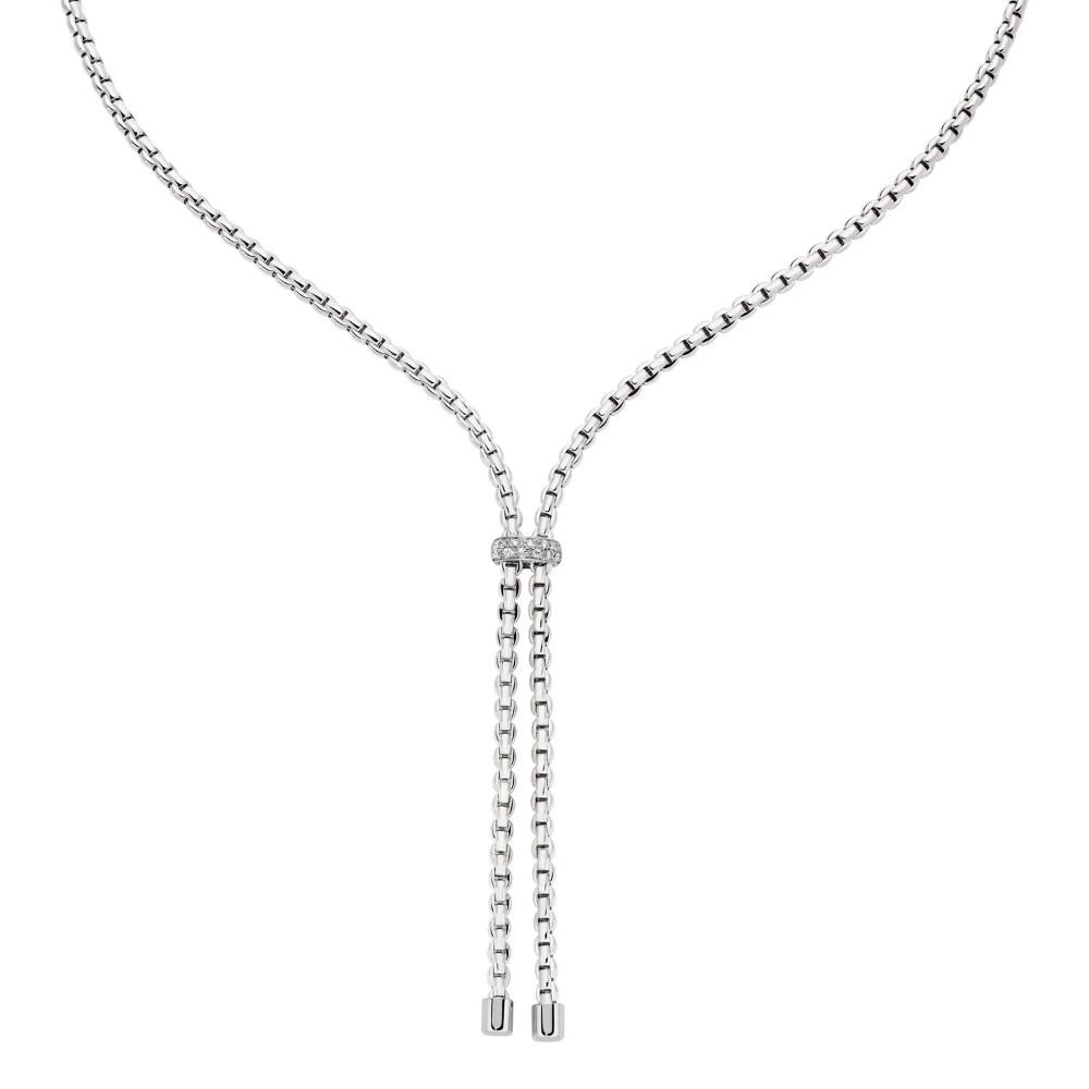 A silver Y-necklace featuring a box chain, a central oval link section set with small clear stones, and two dangling chain tails with cylindrical end caps, shown on a plain white background.