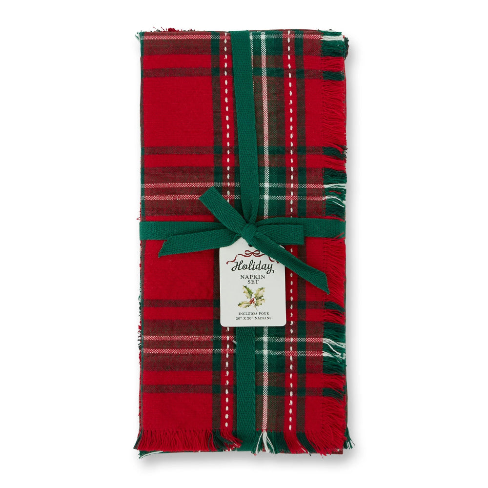 A folded red and green plaid scarf with fringe edges, tied with a dark green ribbon and a white 'Holiday Wreath' gift tag, shown on a plain white background.