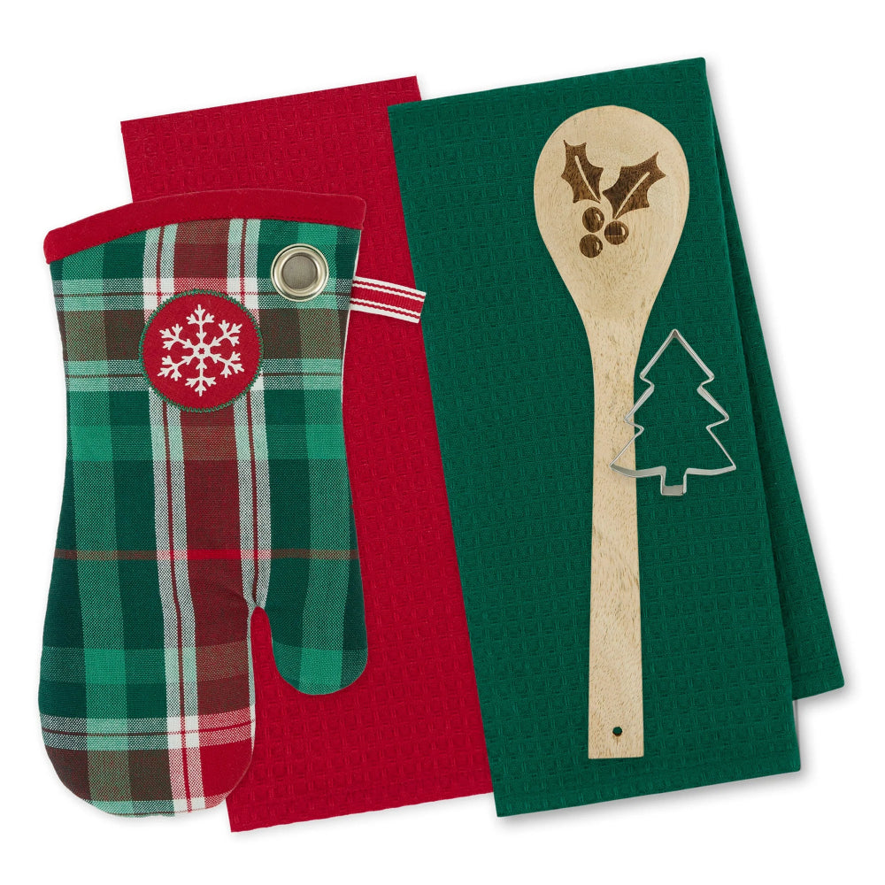 A holiday kitchen accessory set featuring a green and red plaid oven mitt with a red snowflake patch and a wooden spoon-shaped towel with a laser-engraved holly and Christmas tree design, displayed on a white background.