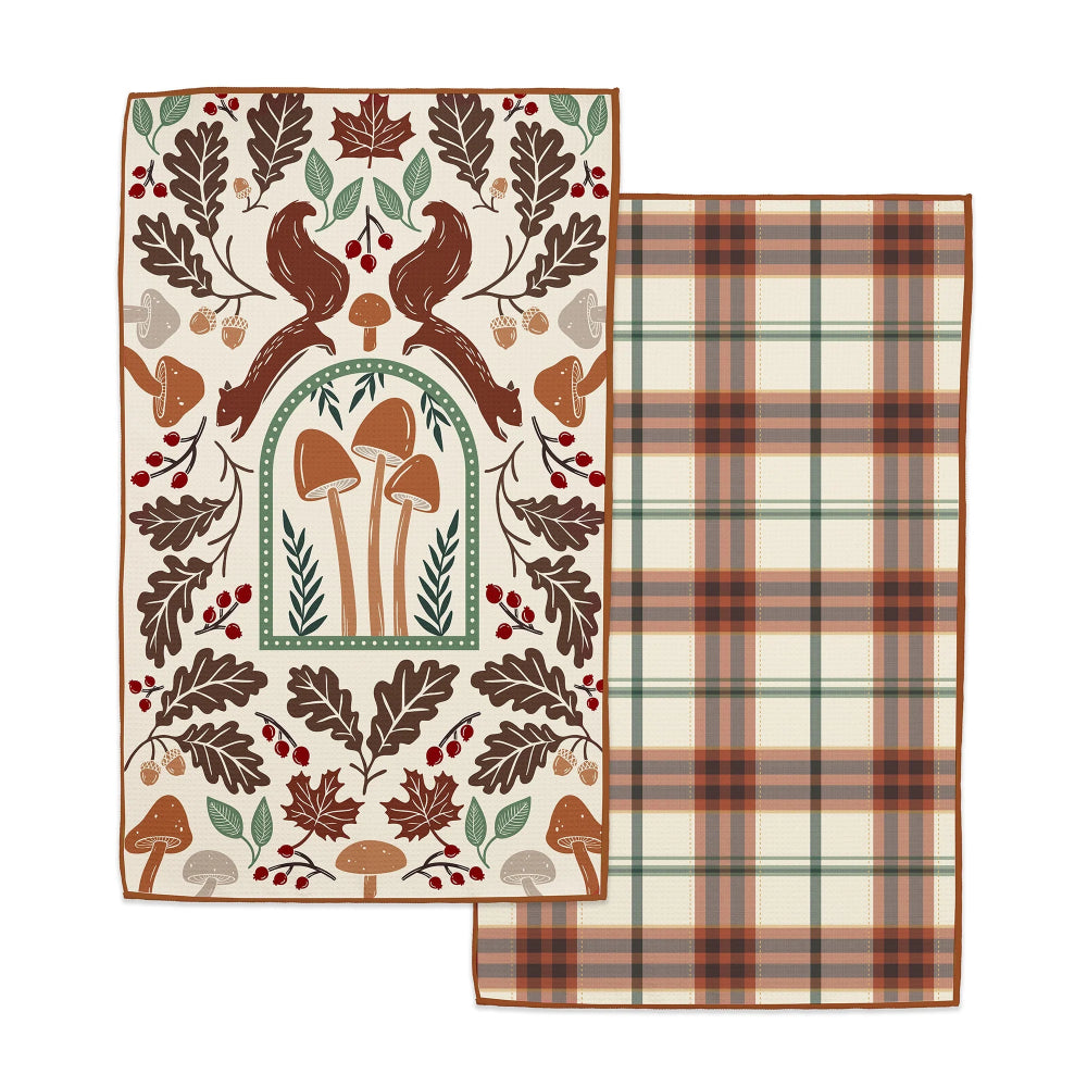 Two decorative towels with autumn-themed patterns on a white background