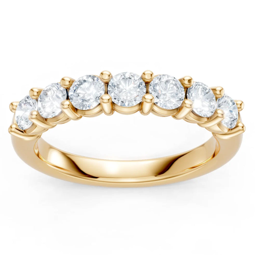 Gold ring with round diamonds on a white background
