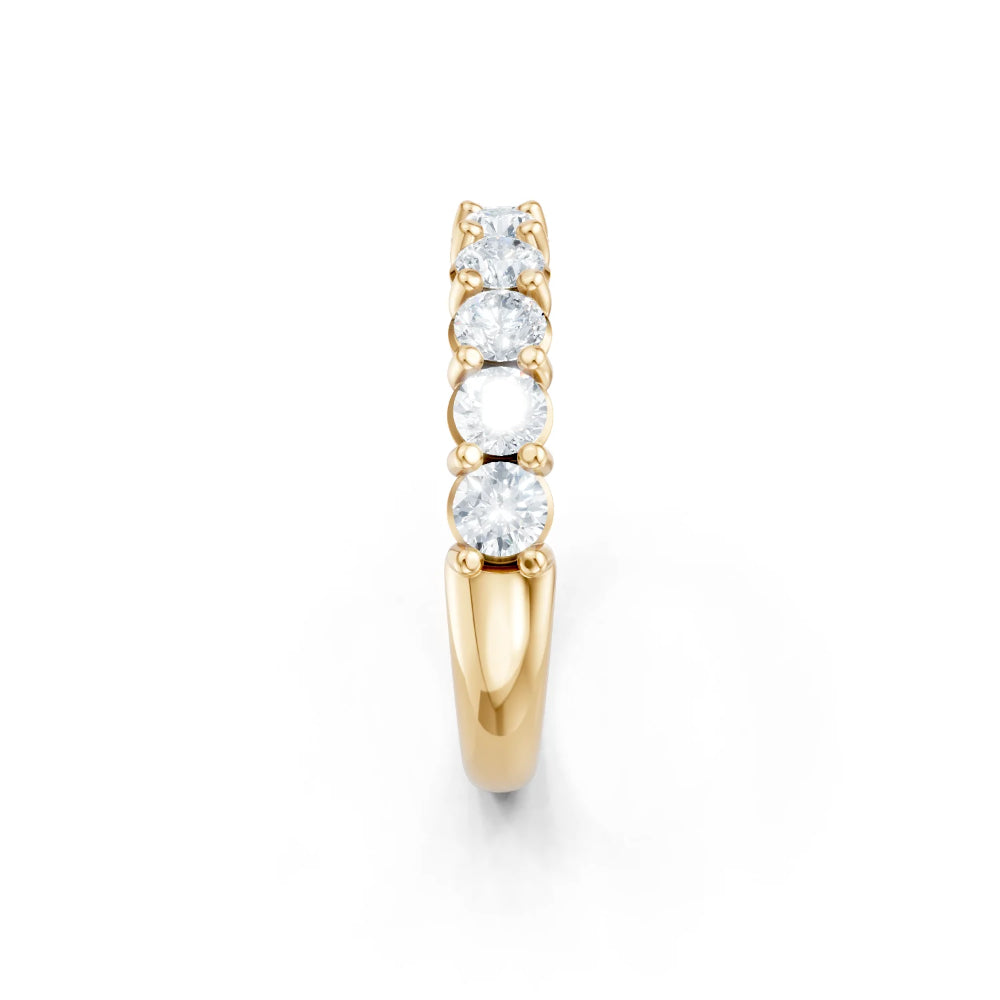 Gold ring with diamonds on a white background