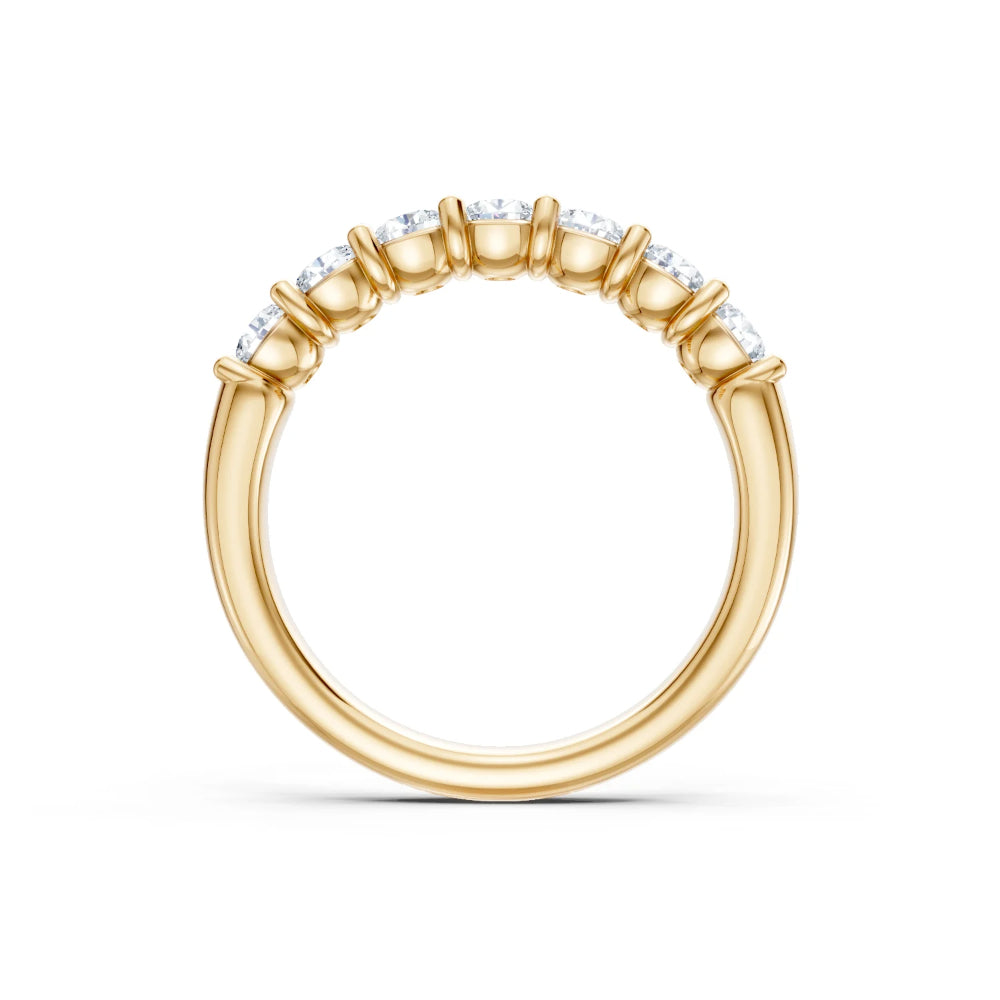 Gold ring from the side on white background