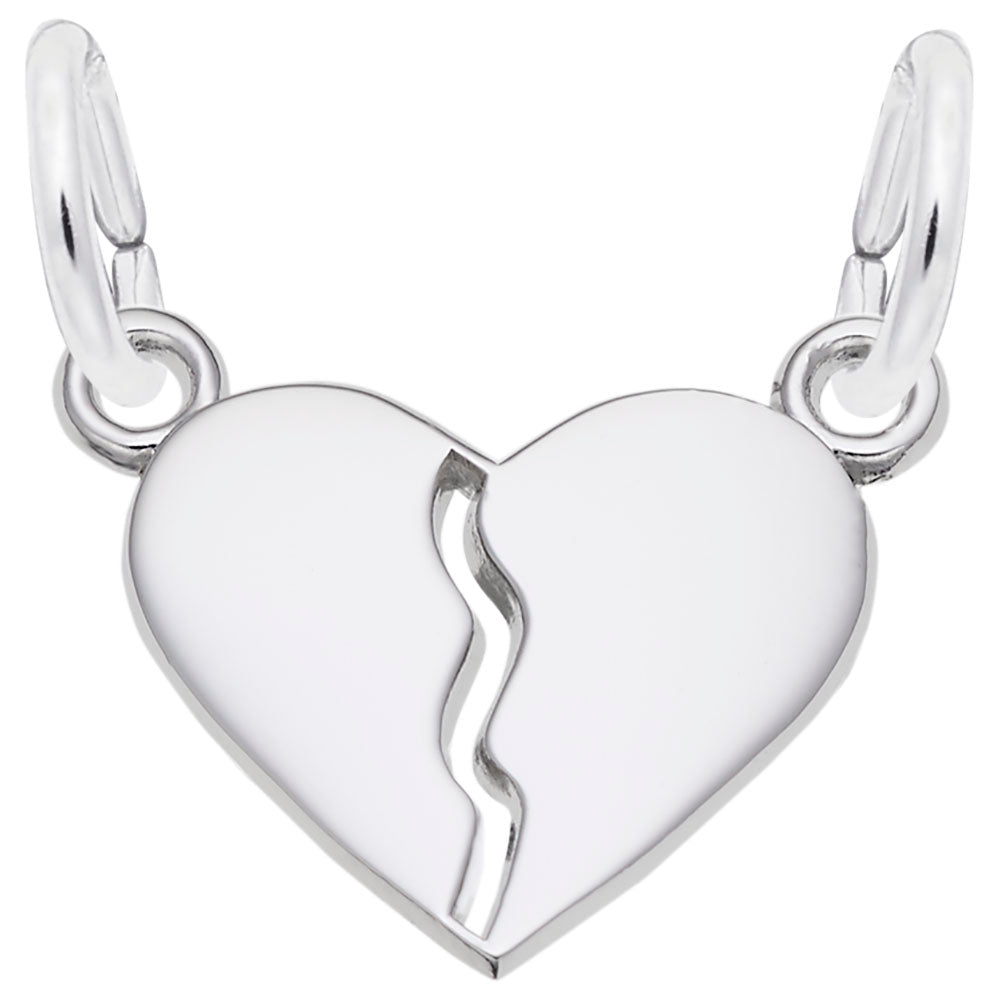 Silver heart-shaped charm with a break line on a white background