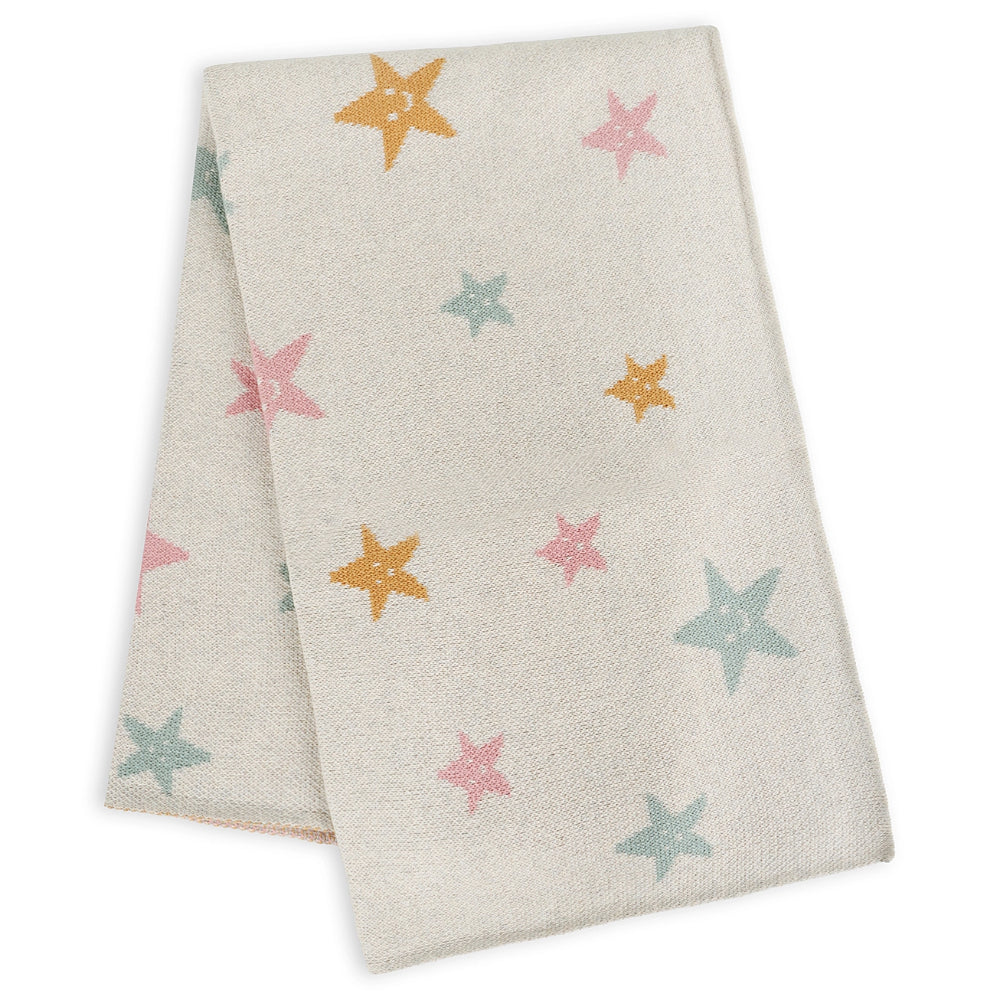 Beige blanket with colorful star patterns on a white background.
