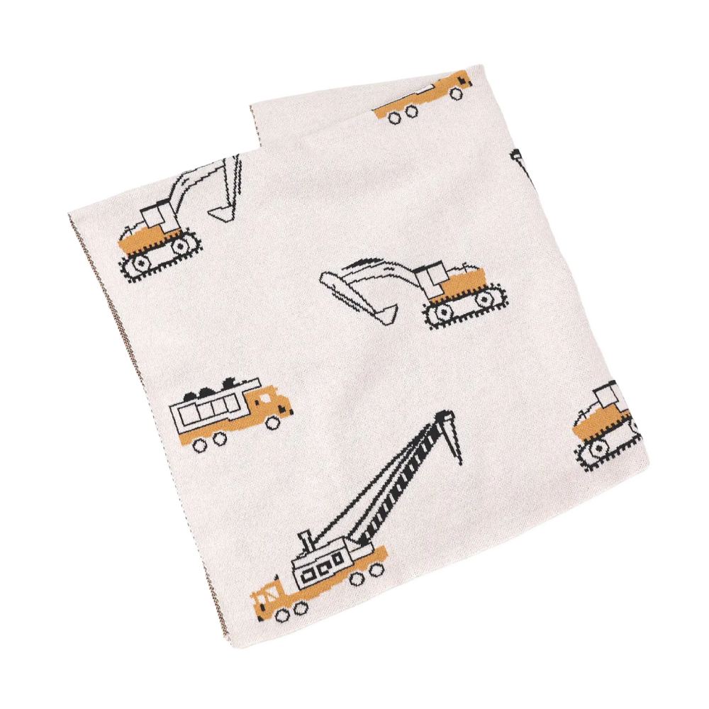 Beige blanket with construction vehicle patterns on a white background.