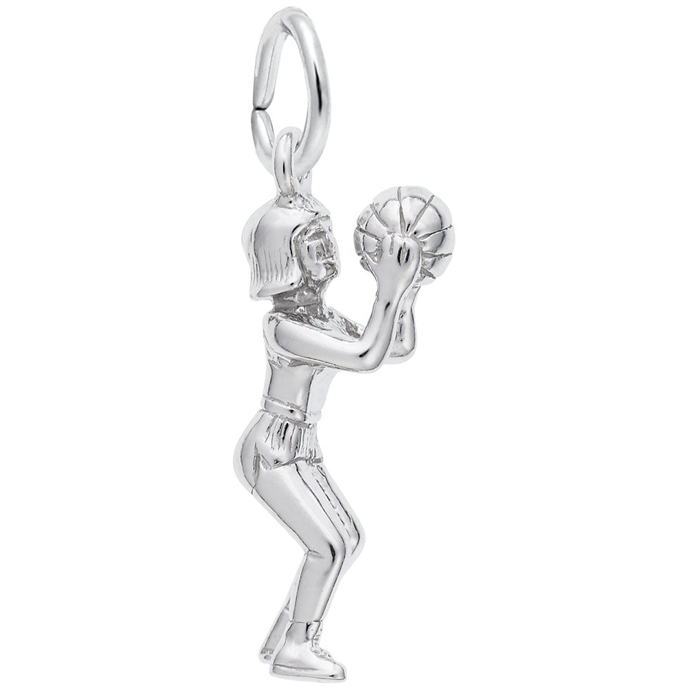 Polished silver charm of a child laying basket ball, shown on a plain white background