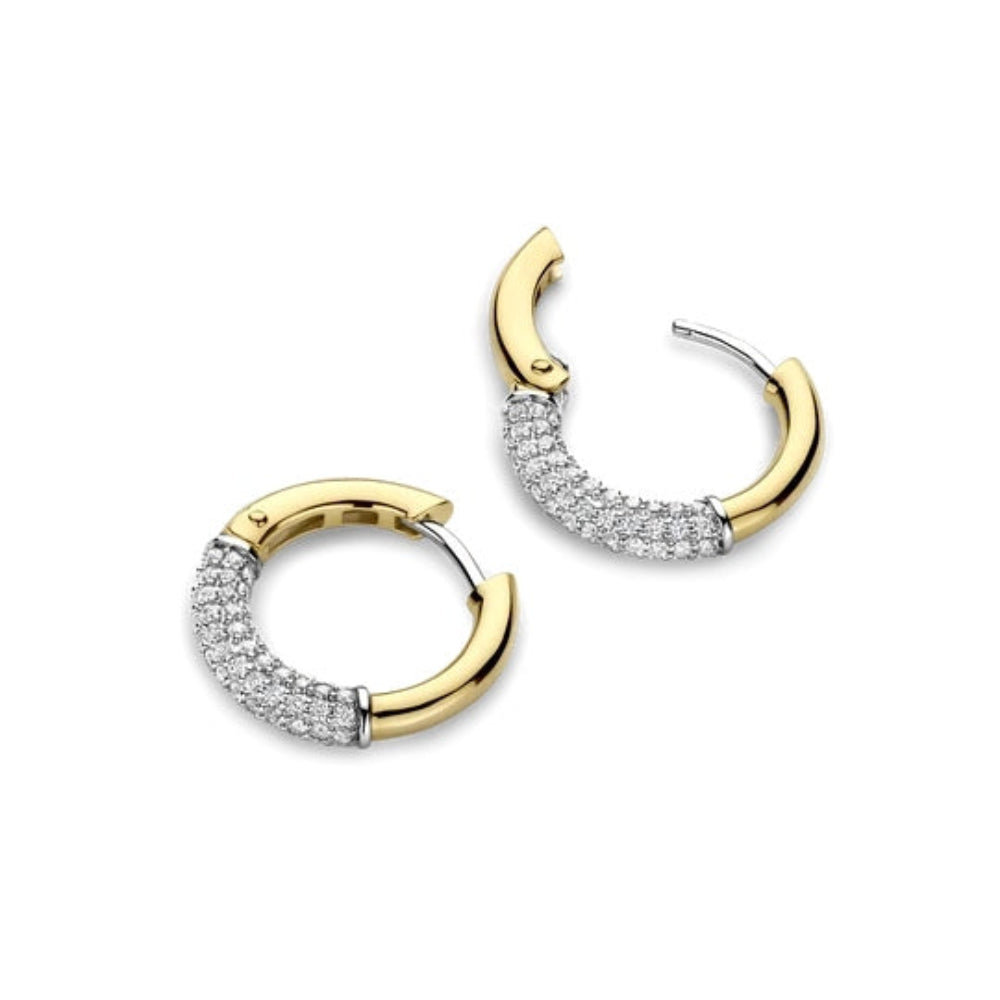 A pair of gold and silver hoop earrings with pavé-set clear stones, shown on a plain white background.
