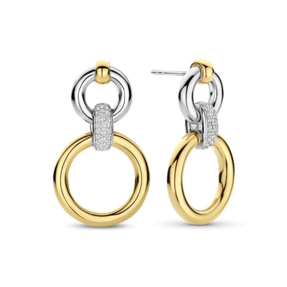 A pair of gold and silver drop hoop earrings with a pavé-set diamond accent, shown on a clean white background.