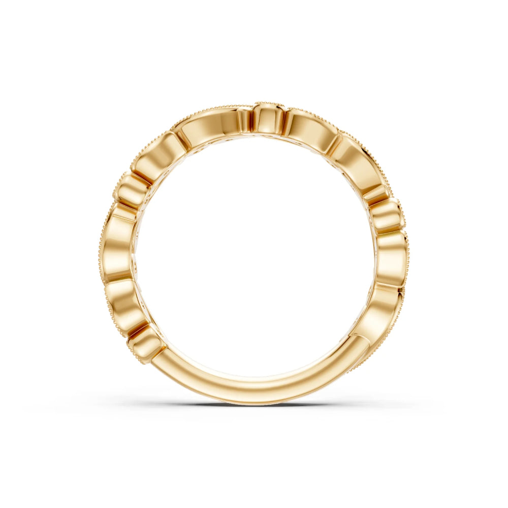 Gold ring with a textured band on a white background