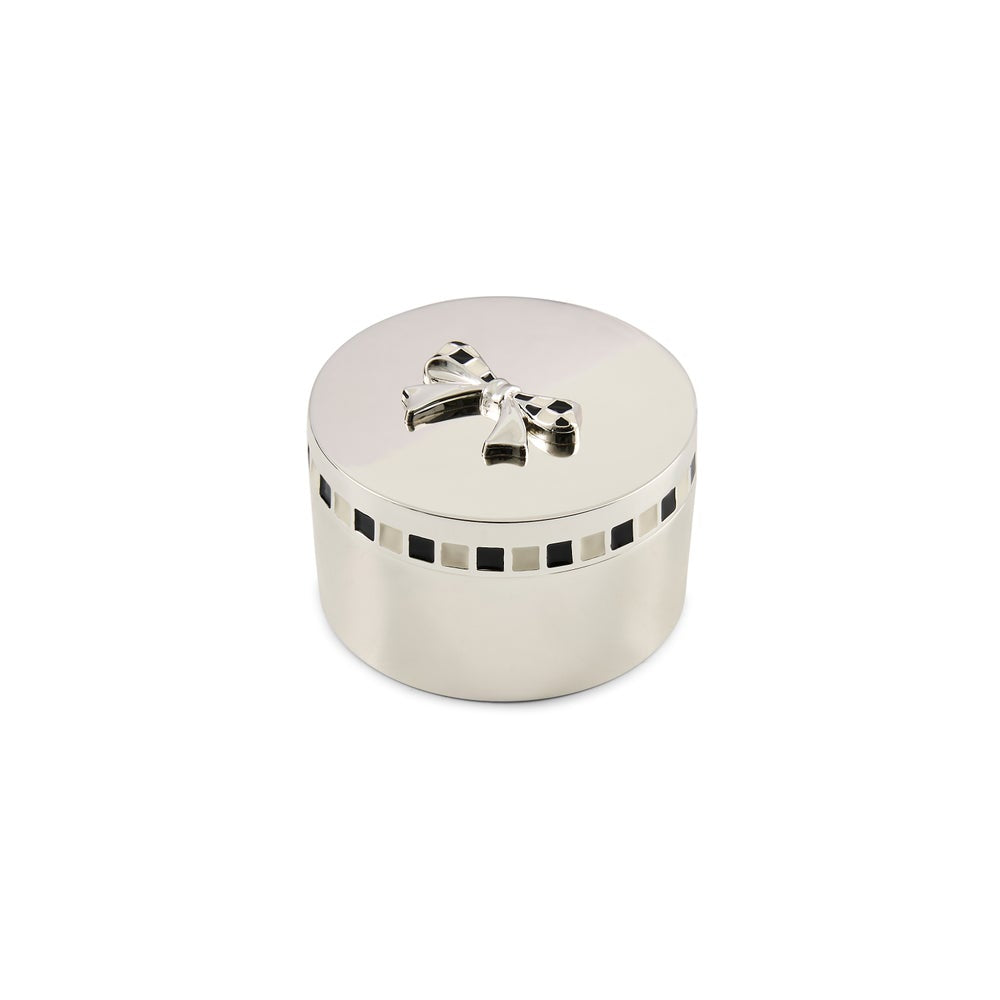 Silver round keepsake box with checkered bow on the lid and a checkered rim around the top of base.