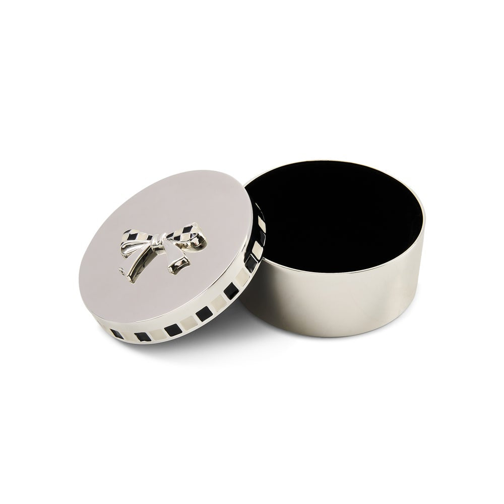 Silver round keepsake box with lid ajar showing black velvet interior of base. 
