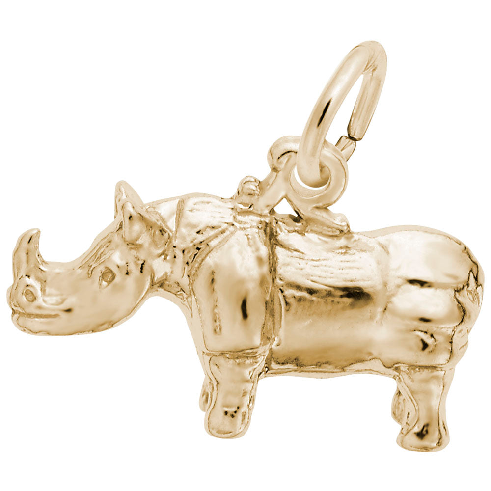 Gold rhinoceros charm on a white background