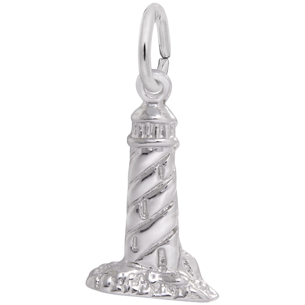 Silver lighthouse charm on a white background