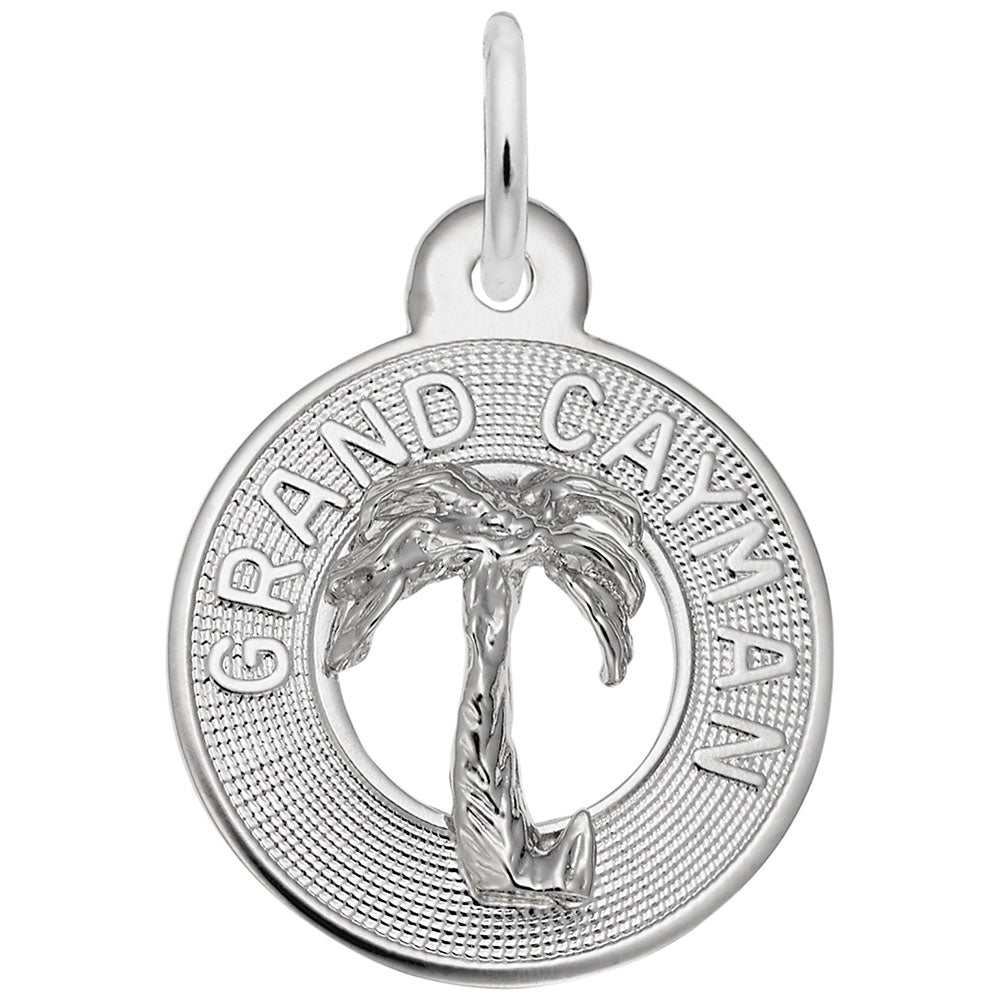 Silver disc charm with palm tree design and 'Grand Cayman' text on a white background