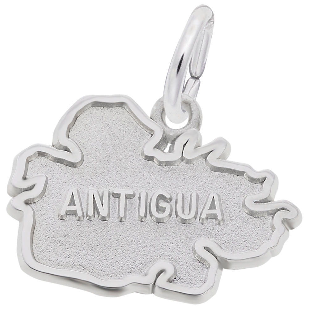 Silver charm shaped like the island of Antigua on a white background