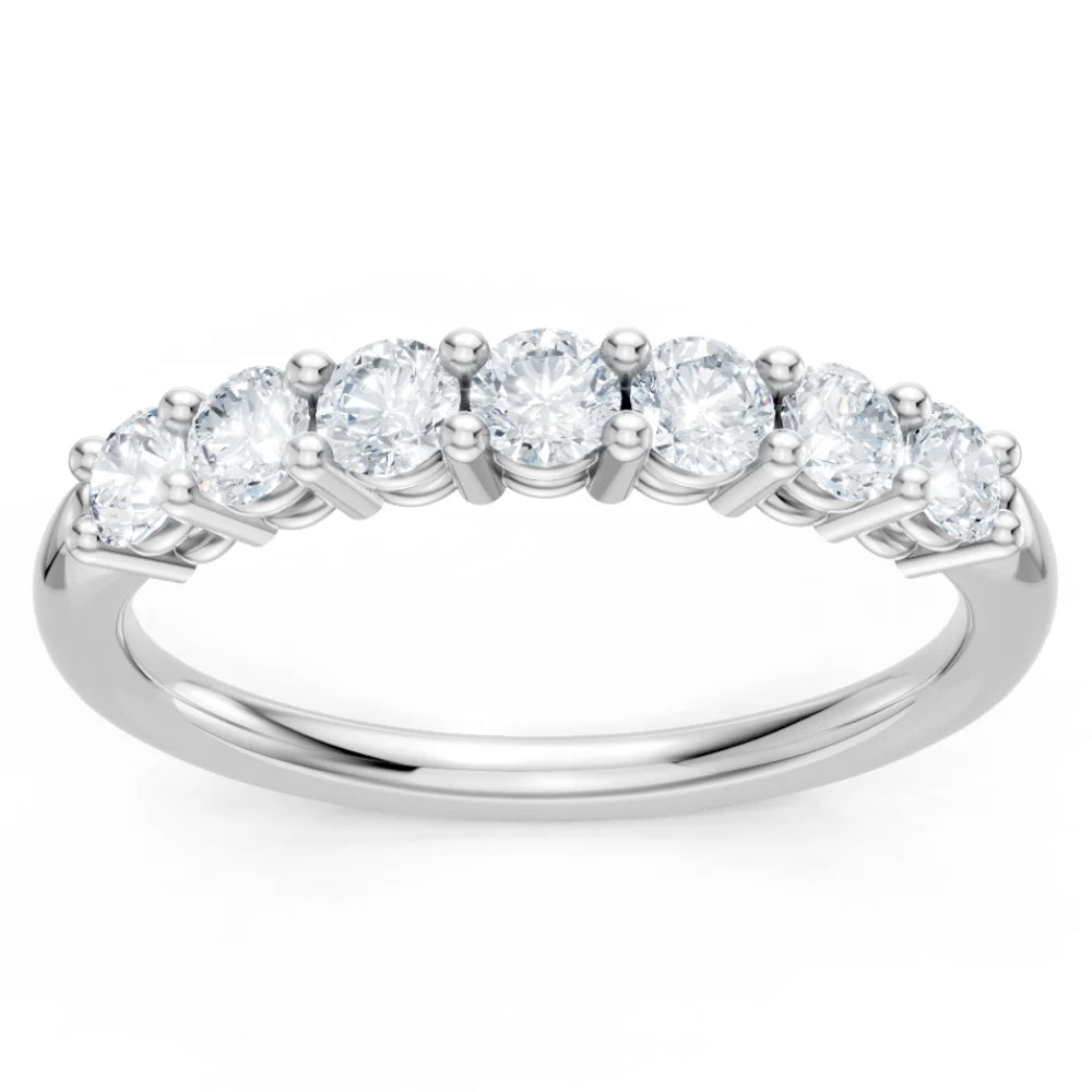 Diamond ring with seven round-cut diamonds on a white background