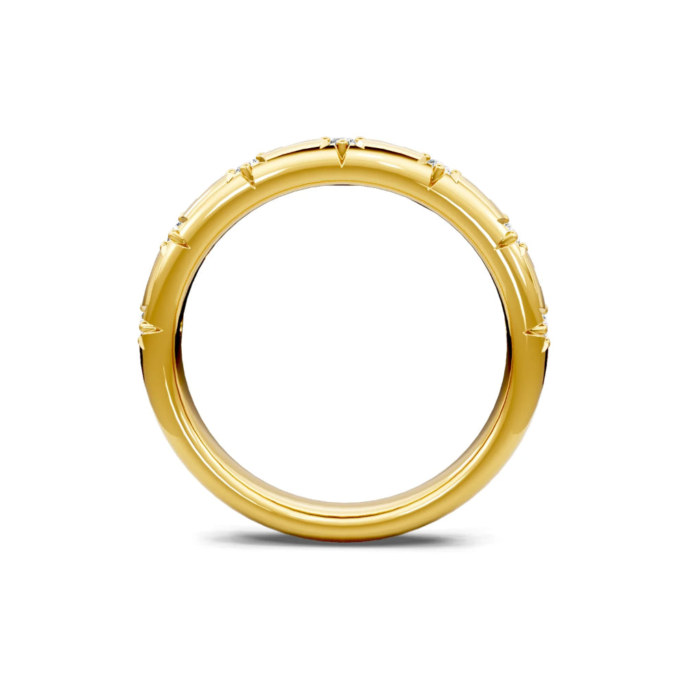 Gold ring with a textured band on a white background