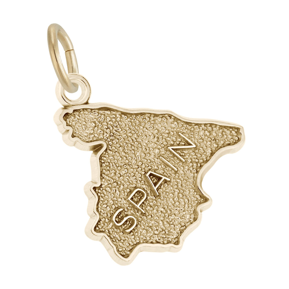 A gold charm shaped like the map of Spain, featuring a textured finish and the word 'SPAIN' engraved vertically on the front, shown on a white background