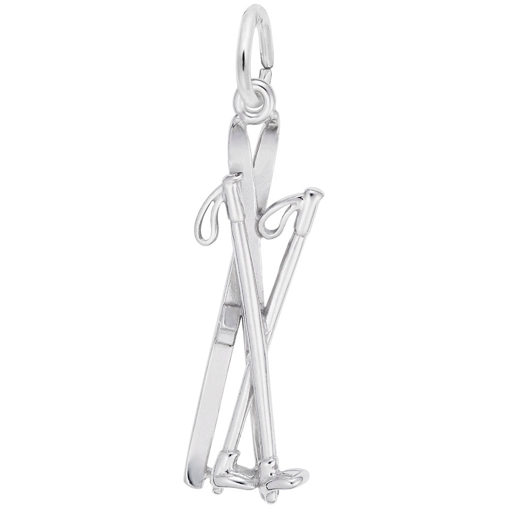 Silver crossed skis and ski poles charm on a white background