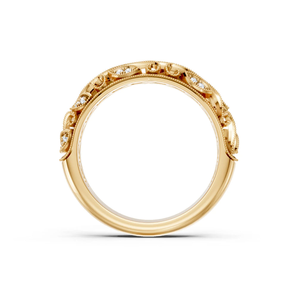 Gold ring with intricate design on a white background
