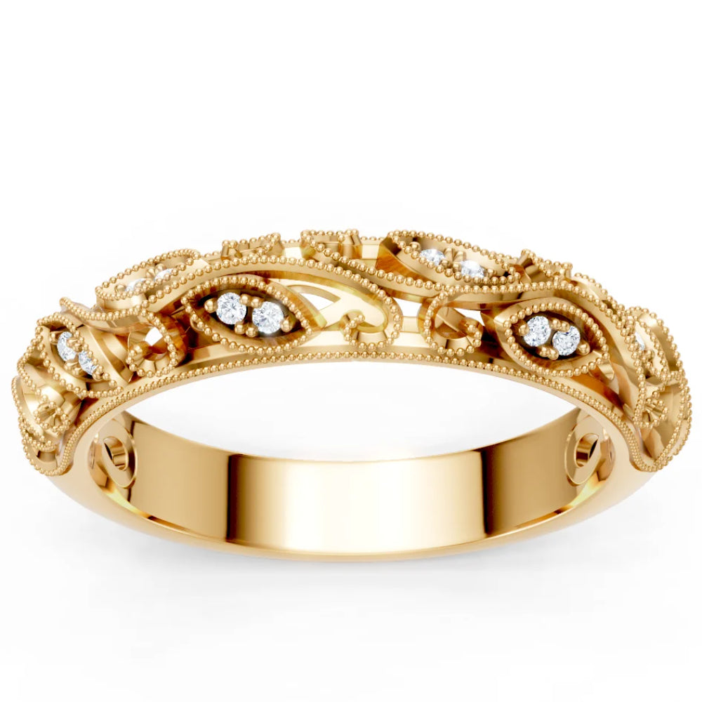 Gold ring with intricate design and small diamonds on a white background