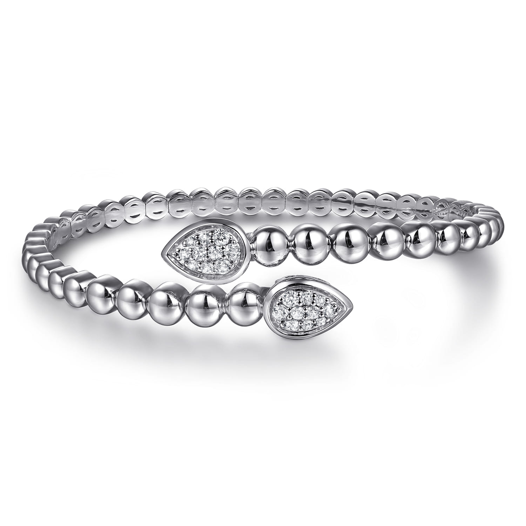 Silver bracelet with diamond accents on a white background