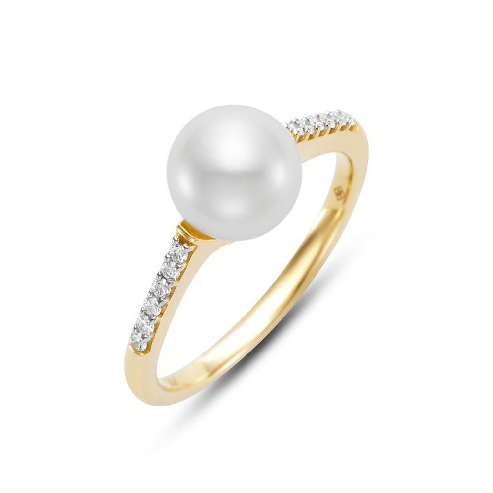 Gold ring with a pearl and small diamonds on a white background