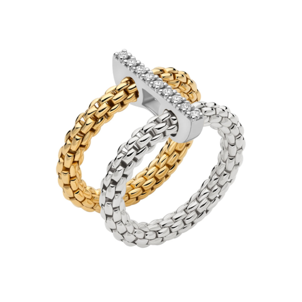 A two-tone ring featuring interlocking braided loops in yellow gold and silver, with a polished T-shaped top accented by small clear stones, shown on a plain white background.
