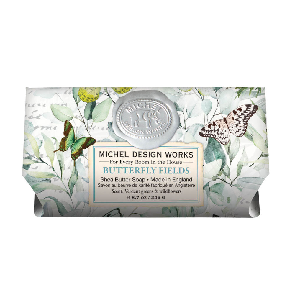 Bar of soap with butterfly design and 'Michel Design Works' branding on a white background