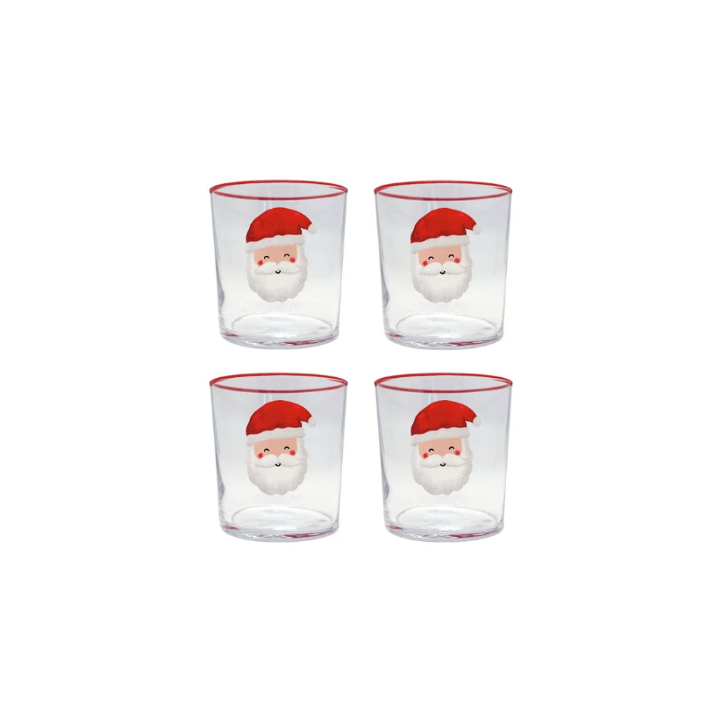 Santa themed double old fashioned glasses with santa faces on them and red rims on a white backround.