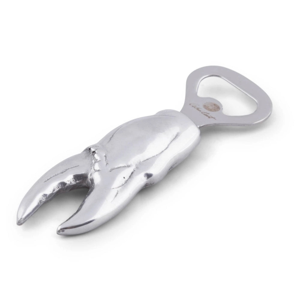 Metallic crab claw bottle opener on a white background