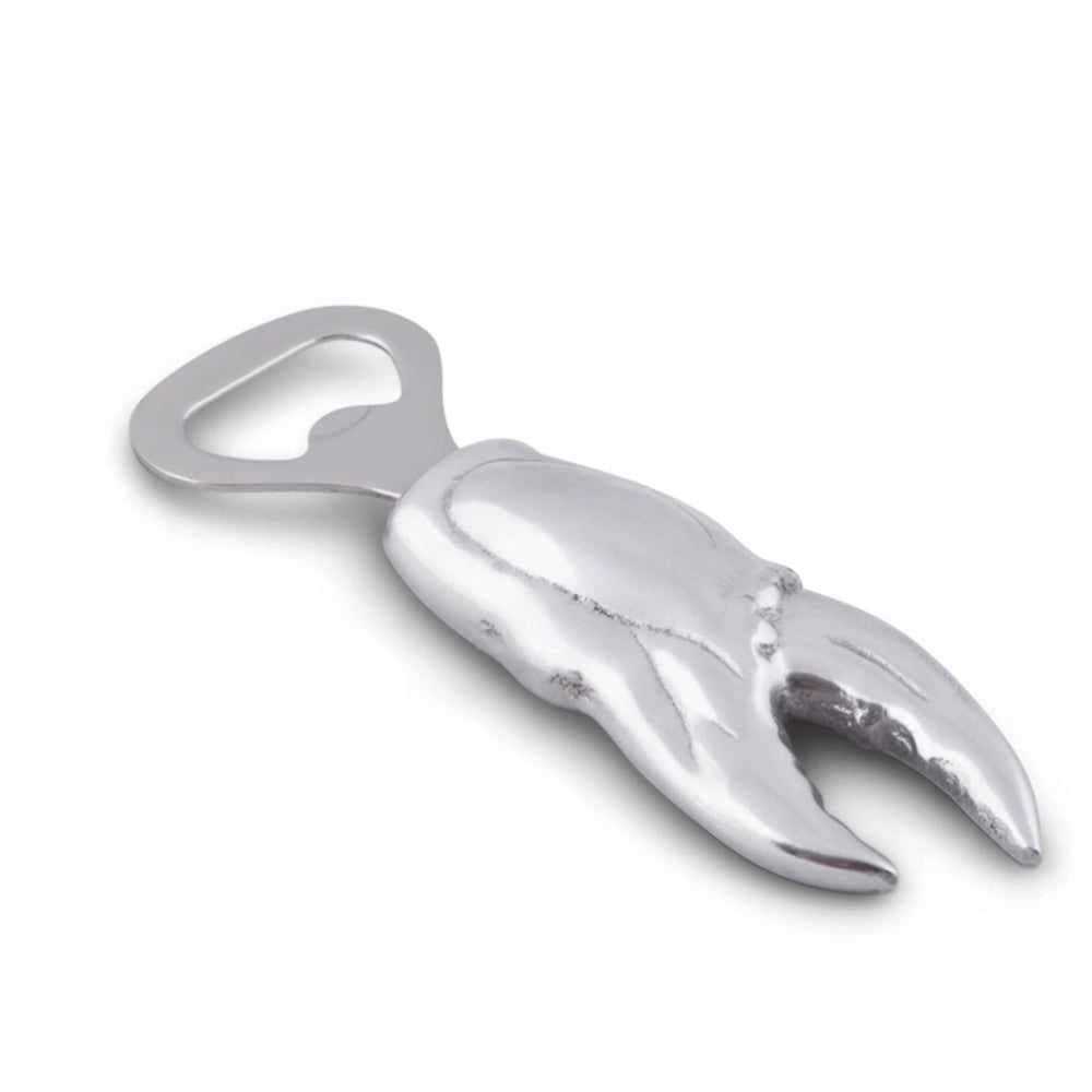 Metallic crab claw bottle opener on a white background