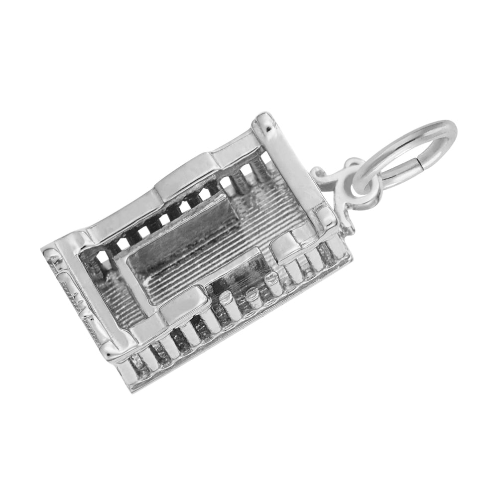 Top down view of a silver Parthenon shaped charm with textured floor, shown on a white background
