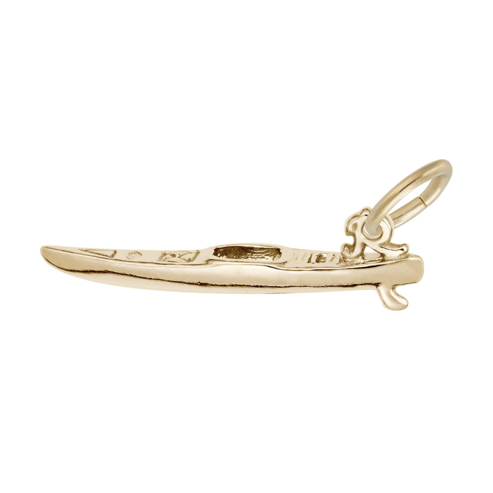 A Gold charm, featuring a central oval opening and geometric engravings, shown on a plain white background.