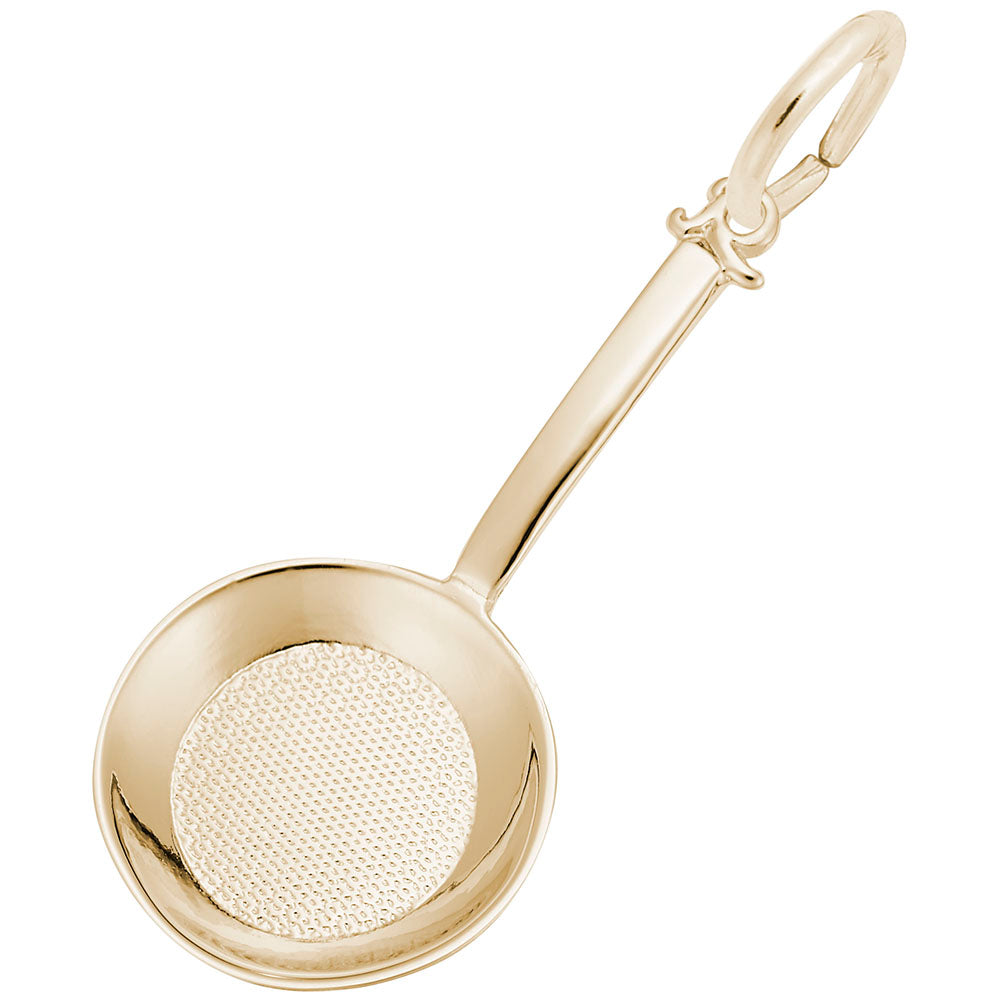 Gold frying pan-shaped charm on a white background