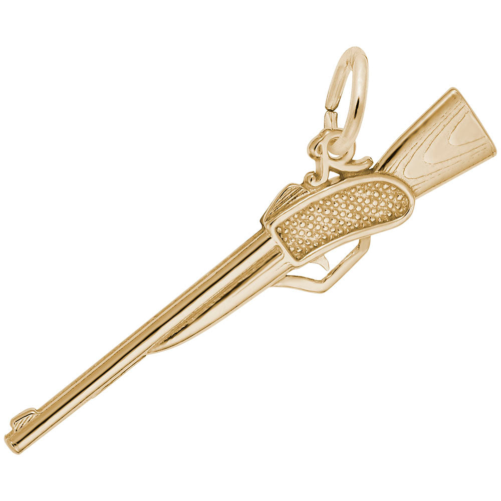 Gold rifle-shaped charm with textured finish, shown on a white background